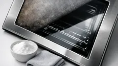 How to clean oven door glass with baking soda for a crystal-clear view